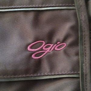 Ogio sling backpack. Black wit purple accents.